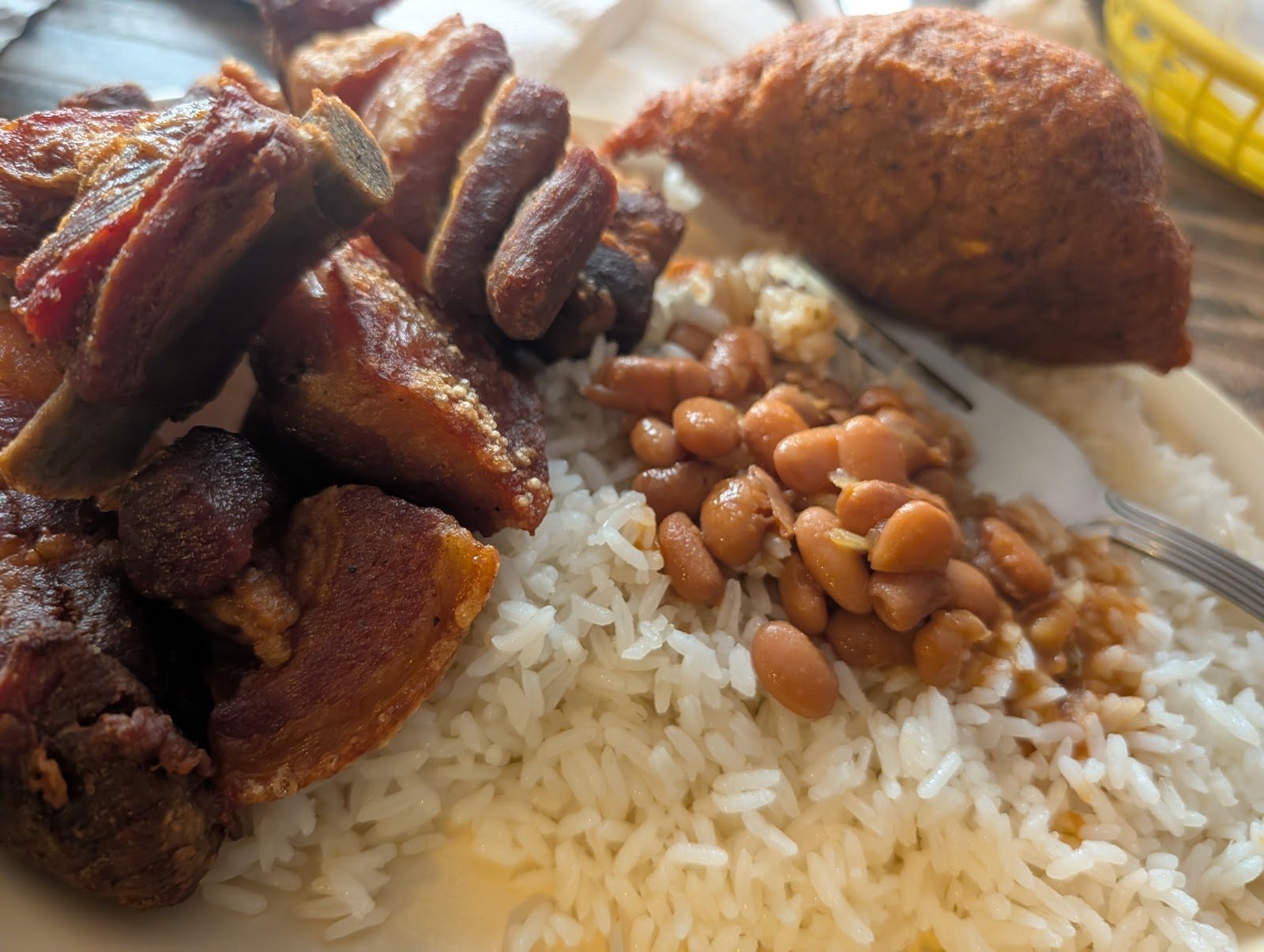 Pernil, alcapurria, rice and beans
