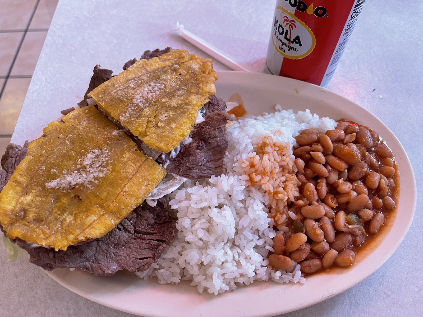 Plate with tostones, rice and beans